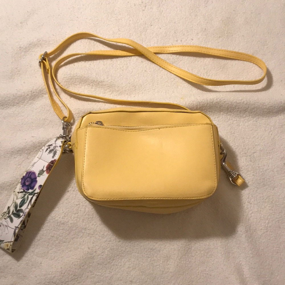 Yellow cross body small purse.